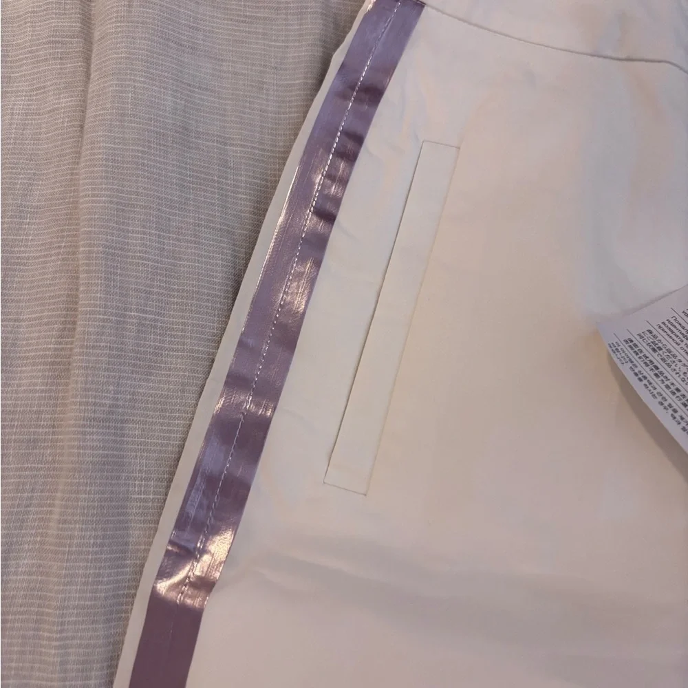 Stylish Y2K-inspired white pants accented with pink purple reflecting stripes - Picture 4 of 8